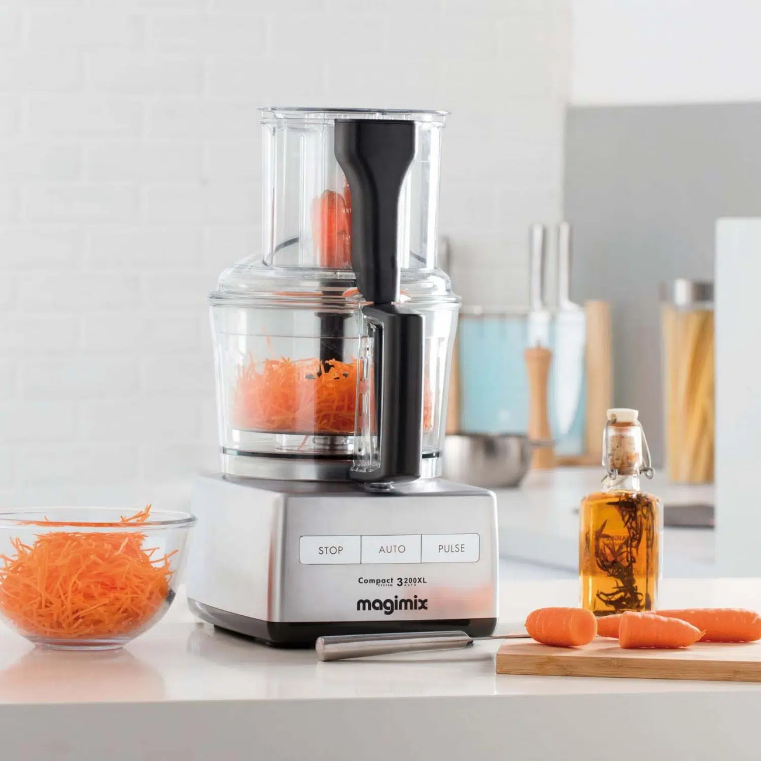 Magimix MX3200CH food processor front view with mixed vegetables inside